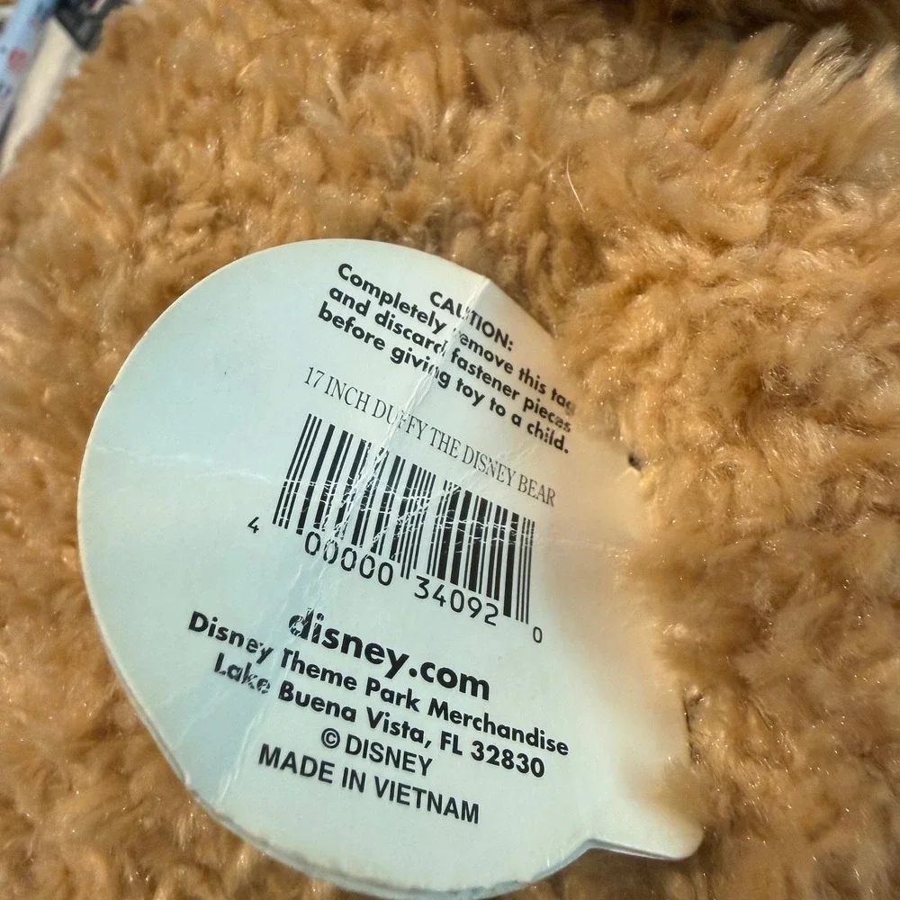 Preowned Disney Parks‎ Duffy the Disney Bear plush with original tag attached